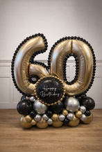 Load image into Gallery viewer, Balloon arrangement with number '60' and 'Happy Birthday' text on a wooden floor.