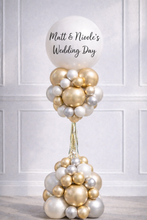 Load image into Gallery viewer, Balloon sculpture with 'Matt & Nicole's Wedding Day' text against a white paneled wall.