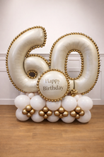 Load image into Gallery viewer, Balloon arrangement with '60' and 'Happy Birthday' on a wooden floor.
