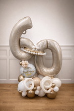Load image into Gallery viewer, Decorative balloon arrangement with number '60' and baby shower balloon on a wooden floor.