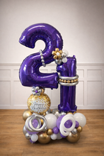 Load image into Gallery viewer, Purple number 2 and 1 balloon with decorative elements on a wooden floor.