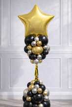 Load image into Gallery viewer, Balloon arrangement with a gold star balloon on a white paneled wall background