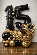 Load image into Gallery viewer, Black and gold balloon arrangement number 15 with a chain made out of gold balloons
