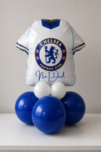 Load image into Gallery viewer, Balloon sculpture of a Chelsea FC jersey with blue and white balloons on a plain background
