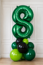 Load image into Gallery viewer, Green, black, and lime green balloons arranged to form the number '8' against a white paneled wall.
