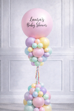 Load image into Gallery viewer, Pastel balloon bouquet with 'Laura's Baby Shower' text against a white paneled wall.
