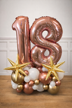 Load image into Gallery viewer, Rose gold number '18' balloons with stars and smaller balloons on a wooden surface.

