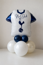 Load image into Gallery viewer, Balloon sculpture of a Tottenham Hotspur football jersey with navy and white balloons on a plain background
