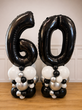 Load image into Gallery viewer, Black and white number '60' balloons with smaller balloons on a wooden surface.
