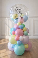 Load image into Gallery viewer, Pastel balloon arch with 'Emily's Baby Shower' text on a wooden floor.
