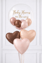Load image into Gallery viewer, Heart-shaped balloons in rose gold and bronze with 'Baby Harris on the way' text against a white background
