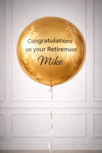 Load image into Gallery viewer, Gold balloon with 'Congratulations on your Retirement Mike' text against a white paneled wall.
