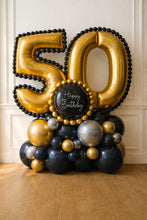 Load image into Gallery viewer, Gold and black balloon arrangement with 'Happy Birthday' text for a 50th celebration.
