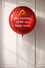 Load image into Gallery viewer, Red balloon with text and logo on a white paneled wall
